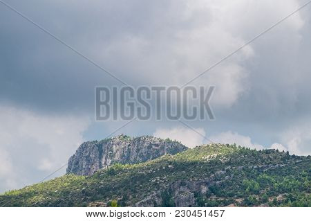 Close-up Of A Big Mountain And Green Nature On A Cloudy Day. View To A Beautiful Natural Green Lands