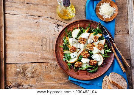 Salad Bowl With Gorgonzola, Arugula, Walnuts And Pear