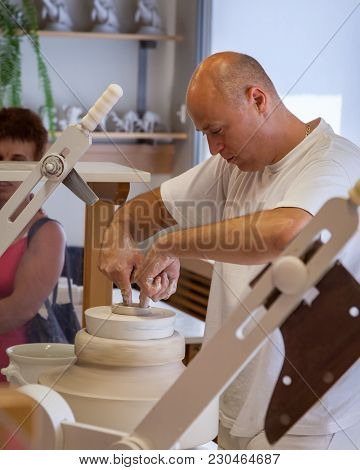 Herend, Veszprem / Hungary - August 03, 2012 - A Herend Porcelain Male Potter Demonstrates How To Ma