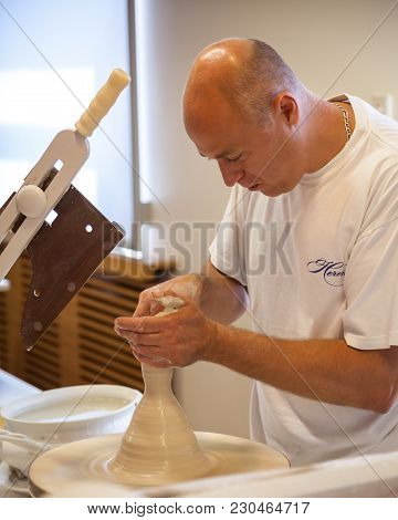 Herend, Veszprem / Hungary - August 03, 2012 - A Herend Porcelain Male Potter Demonstrates How To Ma