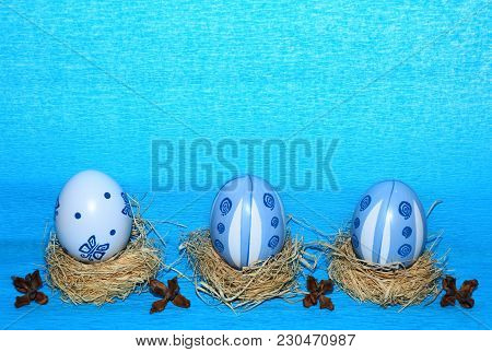 Easter Eggs,straw And Bow-knot On A Blue Background