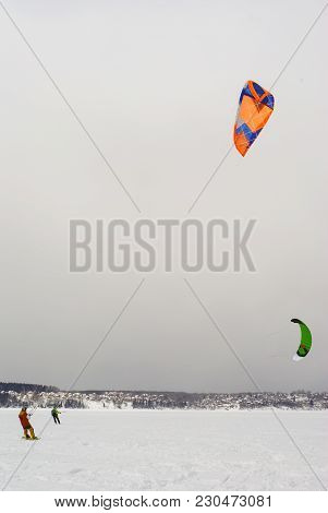 PERM, RUSSIA - MARCH 09, 2018: snowkiters rides on the ice of the Kama Reservoir