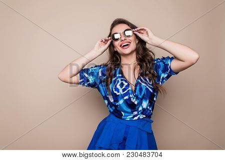 Pretty Young Sexy Fashion Sensual Woman Posing On Color Wall Background. Stylish Fashionable Blonde