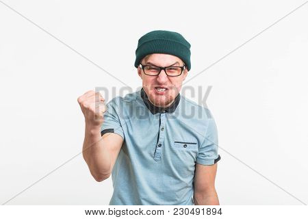 Portrait Of Young Angry Man On White Background.