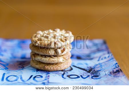 Cookies With Peanuts On A Blue Plate. Cookies Close-up. The Inscription On The Plates Love