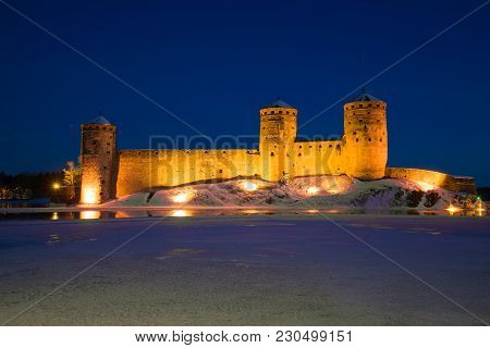 View Of Olavinlinn Fortress In The March Evening. Savonlinna, Finland