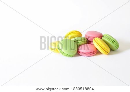 Three Different Types Of Macaroons Colors Pink, Green And Yellow Isolated On White Background With C