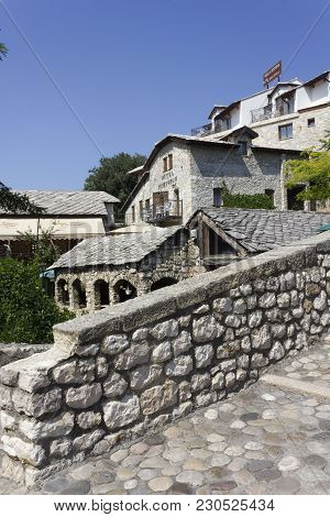 Mostar, Bosnia And Herzegovina - August 17 2017: Ancient Buildings On The Riverside Of Old Kriva Cup