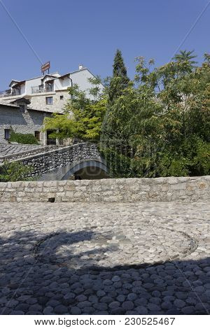 Mostar, Bosnia And Herzegovina - August 17 2017: Ancient Cobblestone Square In Mostar Near An Old St