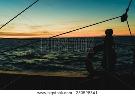 Seascape From The Side Of An Old Wooden Sailboat