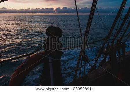 Seascape From The Side Of An Old Wooden Sailboat