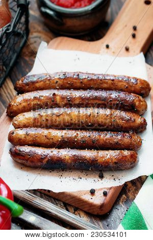 Pork Chipolata. Close-up View Of Fried Sausages. Meat Dish.