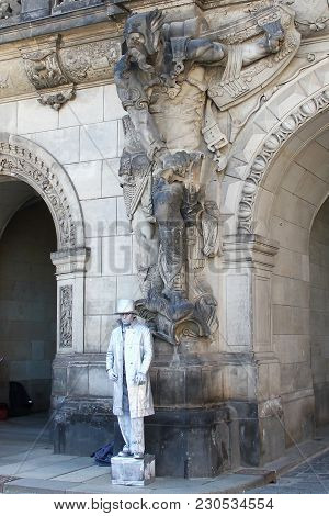 Dresden, Germany - April 27, 2014:this A Mythical Sculpture And Streen Artist Who Are Neighbors At A