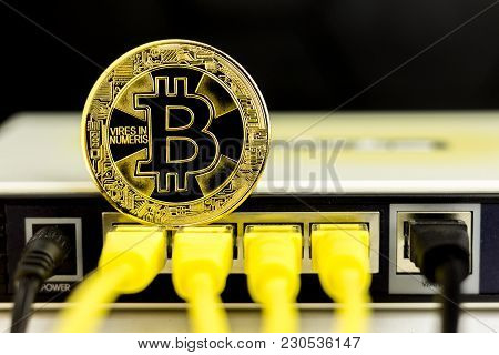 Bitcoin Coin On The Back Of A Router, Symbolizing It's A Web Money.