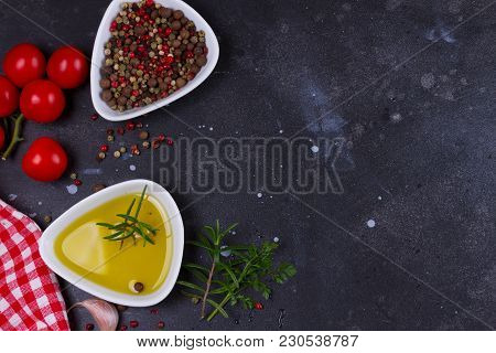 Food Background - Olive Oil And Pper Spices On Black Stone Background, Flat Lay Scene