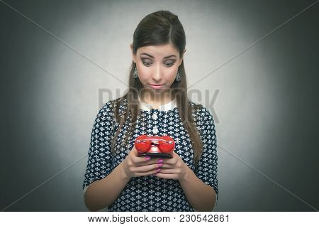 Overslept Shocked Woman Holding In Hand A Red Alarm Clock. Be Late At Work Or School. Oversleep. Lat