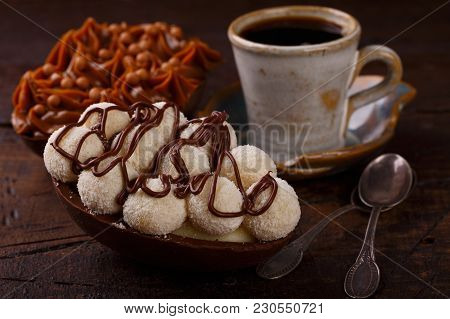 Chocolate Egg Ith Filling For Easter On Wooden Background