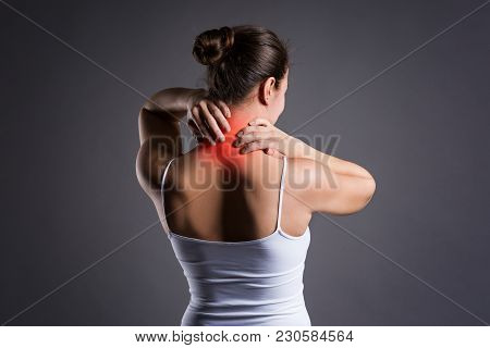 Neck Pain, Woman With Backache On Gray Background, Studio Shot