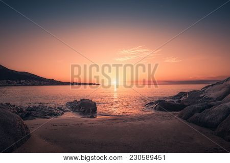 Sunset On Sandy Algajola Beach In Corsica