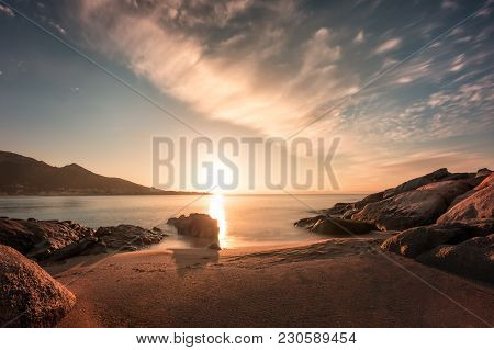 Sunset On Sandy Algajola Beach In Corsica