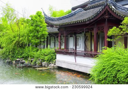 A Pond In Front Of A Building In The Classical Chinese Li Yuan Garden In Zhaojialou Shanghai China.