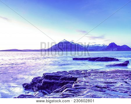 Rocks Near Elgol,  Loch Scavaig,  Isle Of Skye Scotland. Warm Sunset Colors In Cold February Evening