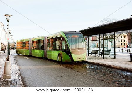 Malmo, Sweden - 29 Dec 2014: Green Articulated Bus Van Hool 324h Exequicity 24 Hybrid Operated By Sk