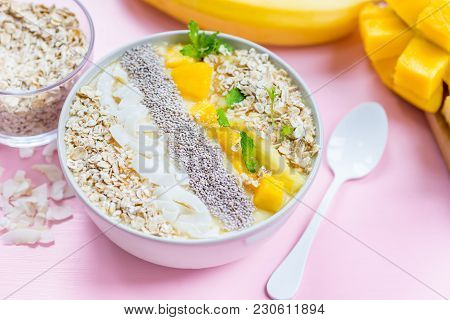 Mango, Banana, Pineapple And Oatmeal Smoothie In The Bowl