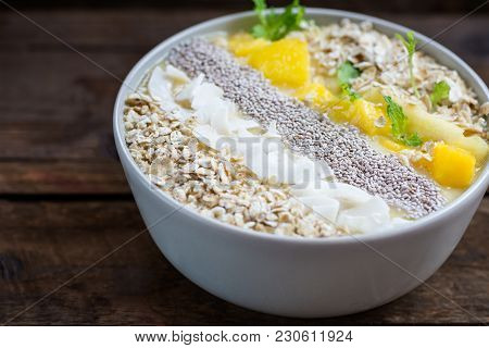 Mango, Banana, Pineapple And Oatmeal Smoothie In The Bowl
