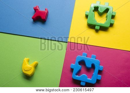 Kids Educational Developing Toys Frame On Colorful Background. Top View. Flat Lay. Copy Space For Te