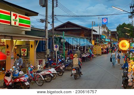 Pai, Thailand - Jan 03, 2017: People Walking On  Pai Night Market At Twilight. Pai Is The Famous Tou