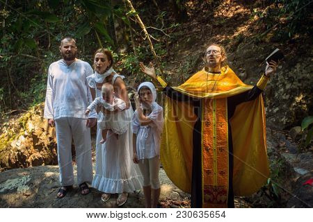 KOH CHANG, THAILAND - MAR 10, 2018: During Christian sacrament of spiritual birth - Baptism. There are currently 10 Orthodox parishes in Thailand, Orthodoxy is practiced by 0.002% of population.