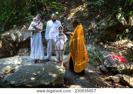 KOH CHANG, THAILAND - MAR 10, 2018: During Christian sacrament of spiritual birth - Baptism. There are currently 10 Orthodox parishes in Thailand, Orthodoxy is practiced by 0.002% of population.
