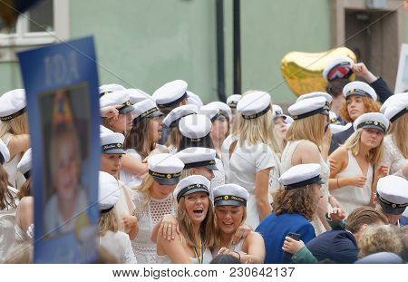 Stockholm, Sweden - Jun 13, 2017: Smiling Students Wearing White Graduation Caps After Graduation At