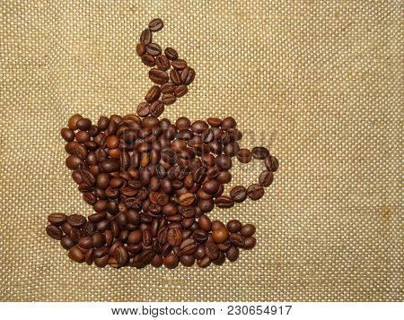 Coffee сup Figure From Roasted Coffee Beans On Burlap
