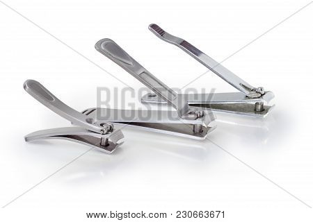 Three Different Nail Clipper In The Compound Lever Style Made Of Stainless Steel On A Matte Reflecti