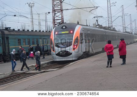 Kostyantynivka, Ukraine - December 05, 2017: Passengers And High-speed Train At The Railway Station 