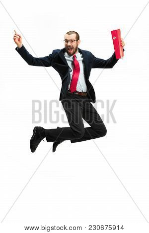 Funny Cheerful Businessman Jumping In Air Over White Studio Background. Jump Of Happy Bearded Young 