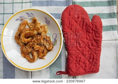 Roman-style Tripe With Tomato Sauce In A Dish On Some Colored Napkins