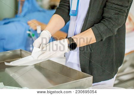 The Nurse With Lots Of Medicine Is Preparing Or Cleaning The Stitch Of Her Woman Patient After Surge