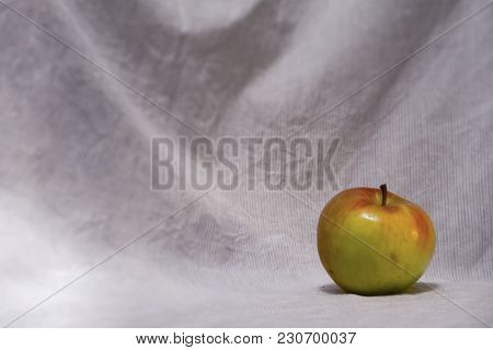 Fresh Yellow Apple On Light Blurry Background