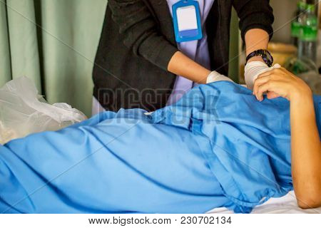 The Nurse With Lots Of Medicine Is Preparing Or Cleaning The Stitch Of Her Woman Patient After Surge