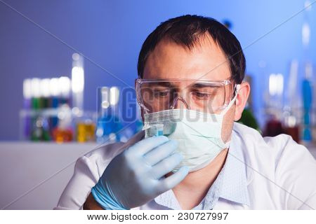 Scientist Is Thinking About Research And Hold Eppendorf Tube