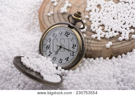 Retro Pocket Watch On White Polystyrene Balls