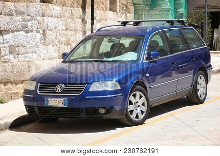 Monopoli, Italy - May 29, 2017: Volkswagen Passat Blue Station Wagon Car Parked In Italy. There Are 