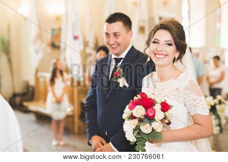 Wedding Couple Bide And Groom Get Married In A Church.