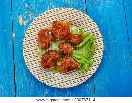 Crispy Buffalo Fried Cauliflower -  Battered Cauliflower Tossed In Garlicky Buffalo Sauce.