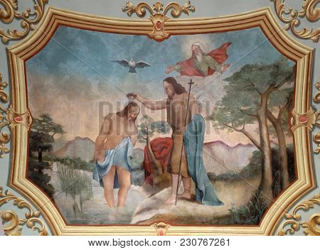 STITAR, CROATIA - NOVEMBER 11: Baptism of the Lord, fresco in the church of Saint Matthew in Stitar, Croatia on November 11, 2016.