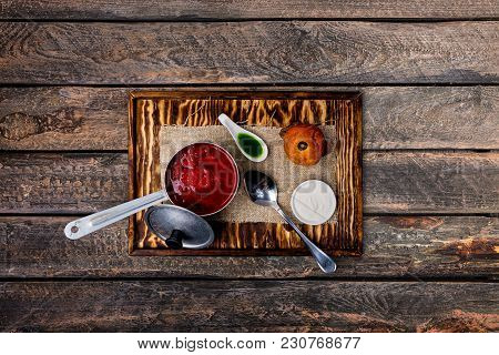 Ukrainian Borsch With Tomato, Beetroot And Brioche. Served On The Rustic Board With A Spoon And Line
