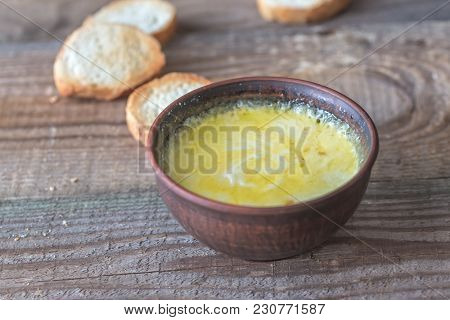 Bowl Of Cheese Dip With Toasts